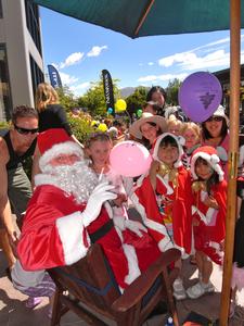 Santa entertains children during a Christmas Fun Day at Remarkables Park Town Centre.